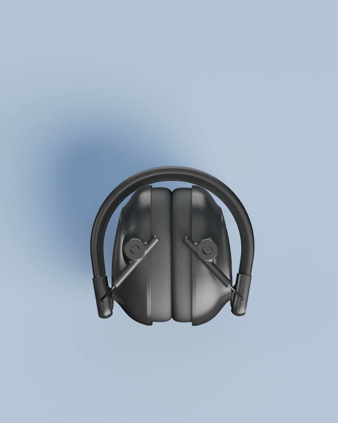 Alpine Defender earmuffs folded, seen from the front on a light blue background
