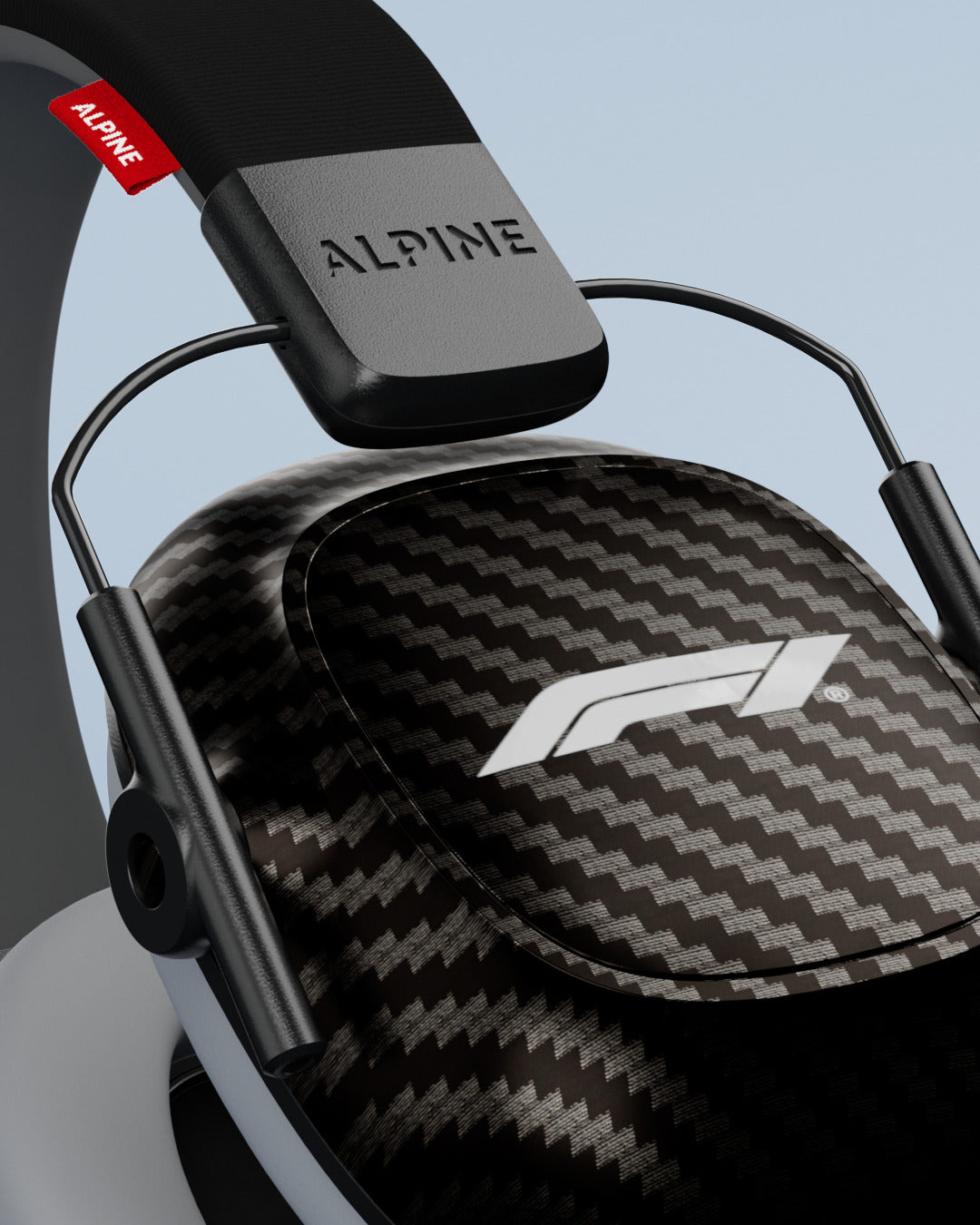 Close-up of an Alpine Formula 1 Racing Muffy ear cup with F1 logo and Alpine headband 