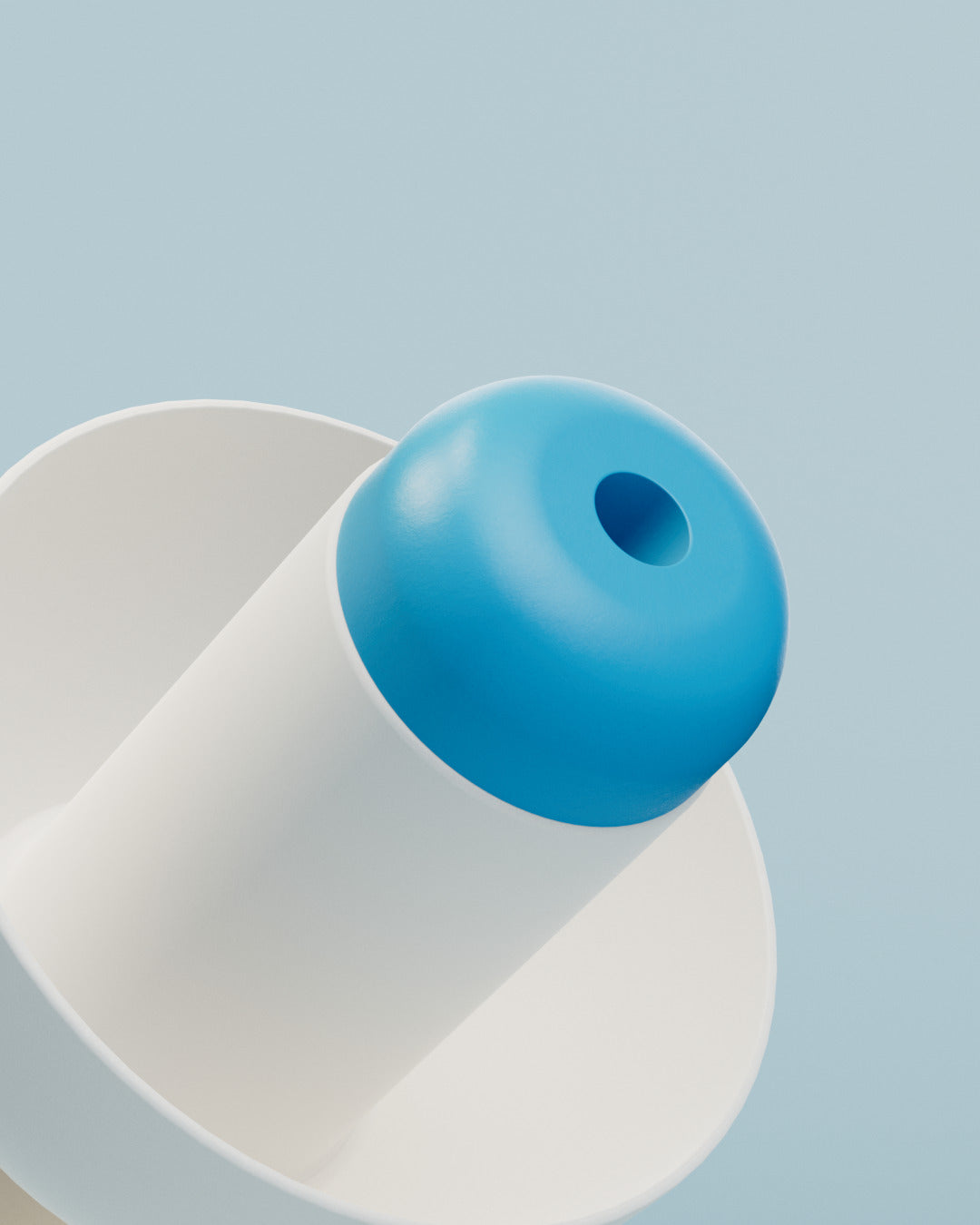 Close-up of the blue tip with central opening on an Alpine SwimSafe earplug 